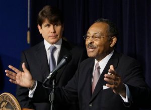 Gov. Rod Blagojevich and, right, Roland Burris.